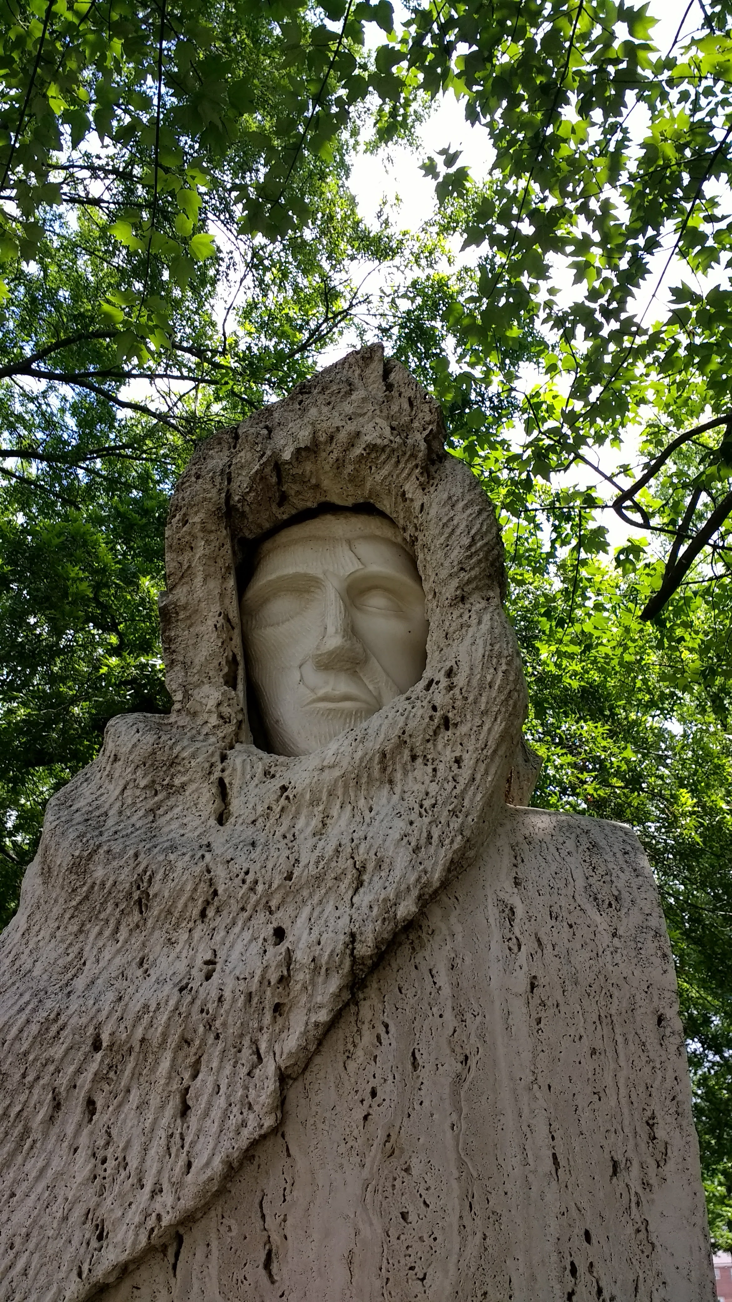 a face of one the statues at the University of Alabame, titled 'Fallen Icarus with his guradian angels'